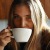 a person drinking from a cup